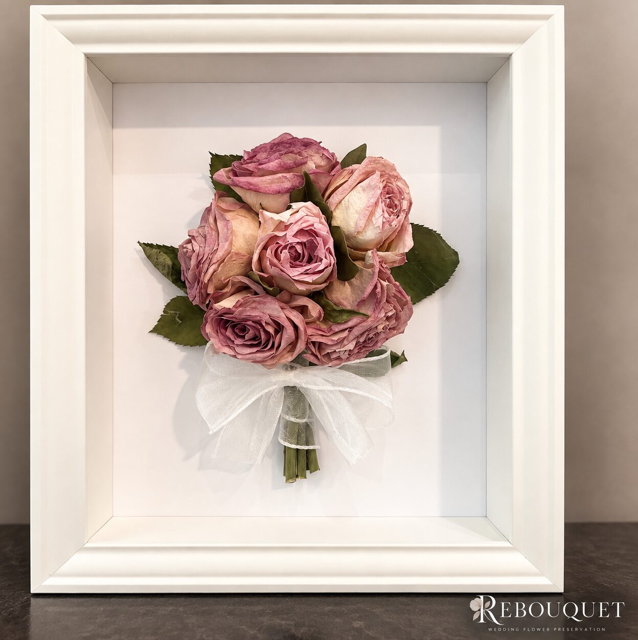 Preserved dusty pink rose bouquet in a white shadow box frame